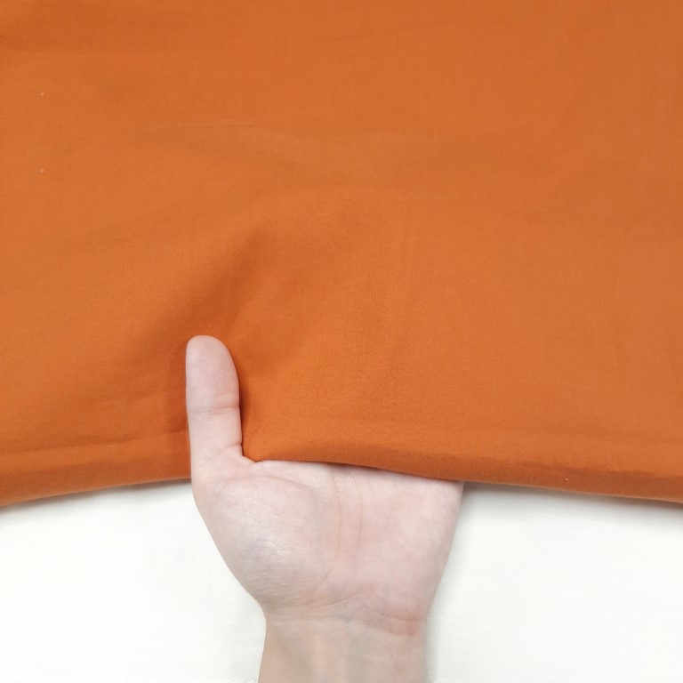 پارچه کتان کش کاغذی ساده رنگ پرتقالی 