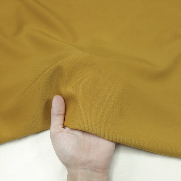 پارچه کتان کش ساده رنگ خردلی کبود 