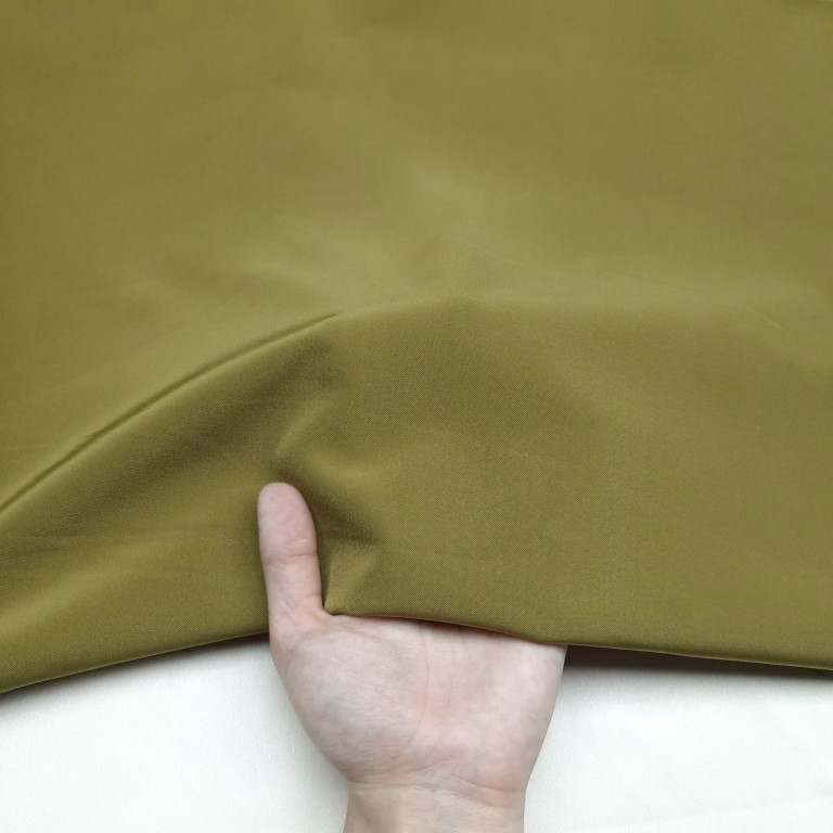 پارچه کتان کش ساده رنگ زیتونی 