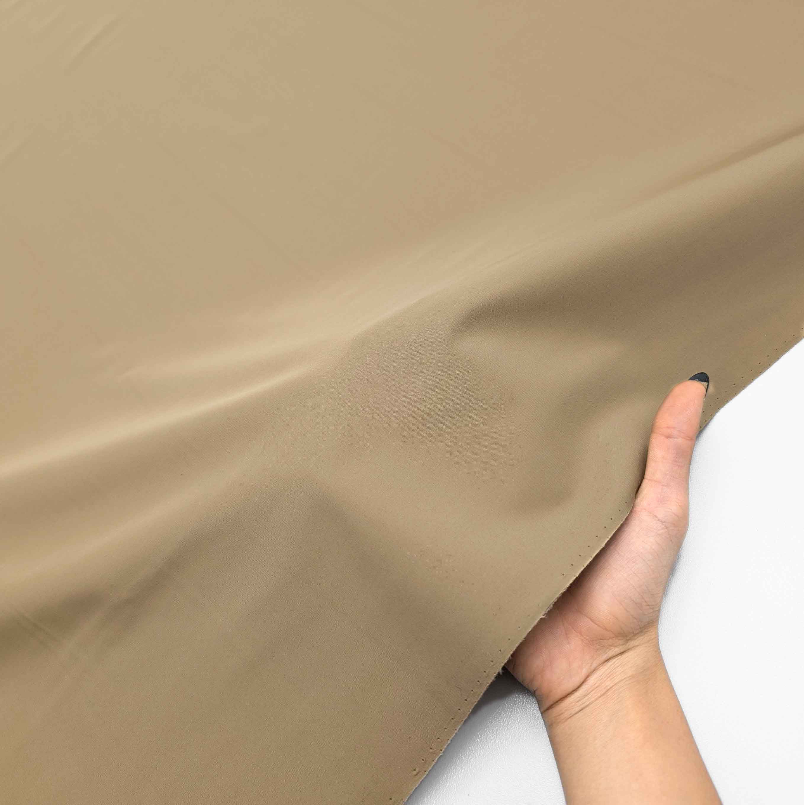 پارچه بارانی پشت بندینگ رنگ شتری 