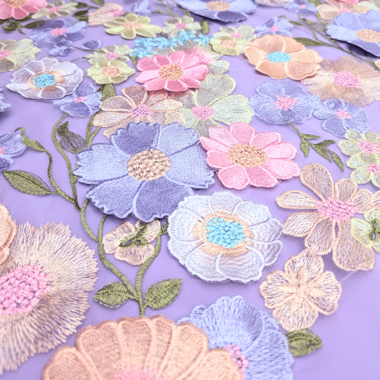 پارچه تور گلدوزی رنگ زمینه یاسی 